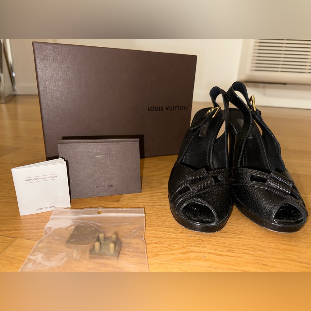 Louis Vuitton black leather heel. COMES WITH AUTHENTICATION, DUST BAGS, AND BOX